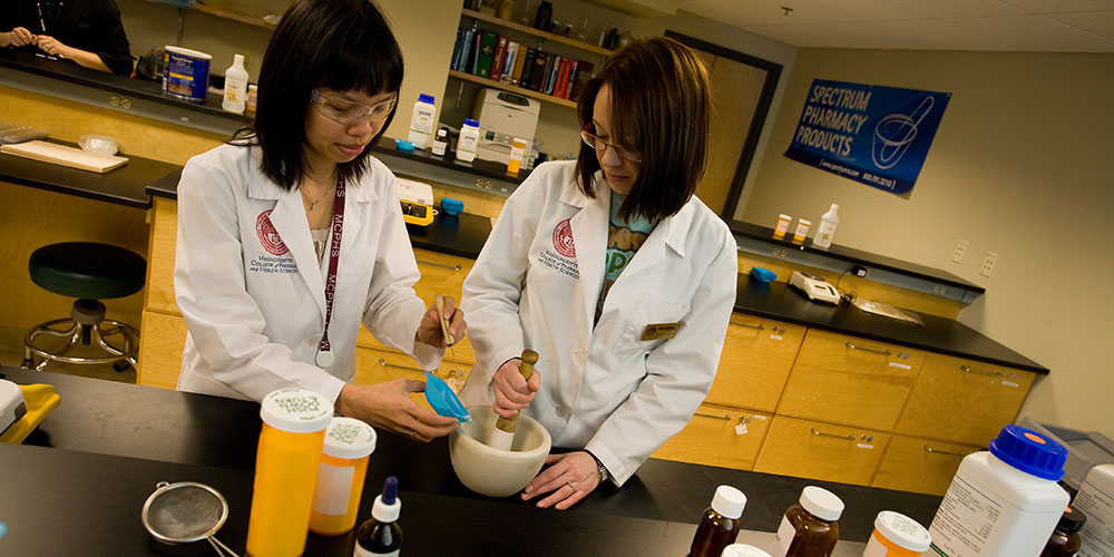 professor and student in compounding lab